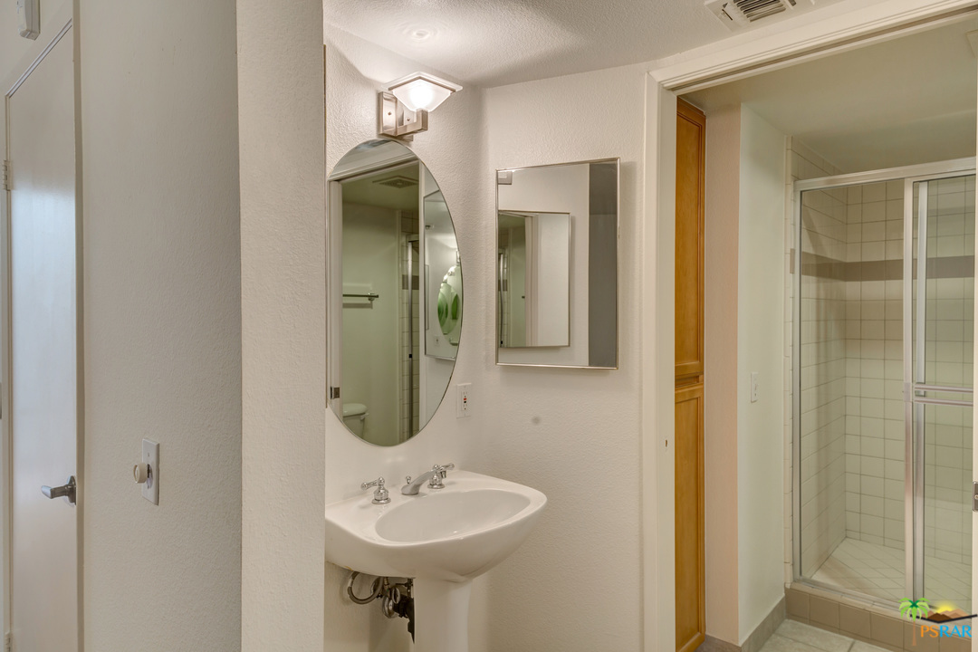 100 East Stevens Road, Unit 509 Palm Springs, CA 92262 - Photo 22 of 37 a bathroom with a sink and a mirror