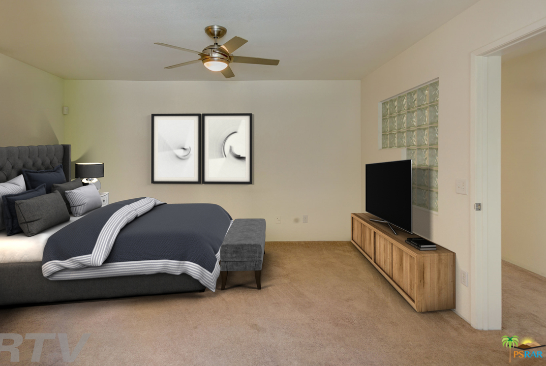 100 East Stevens Road, Unit 509 Palm Springs, CA 92262 - Photo 27 of 37 a living room with furniture and a flat screen tv