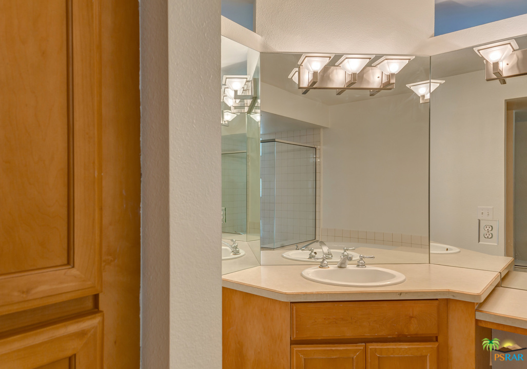 100 East Stevens Road, Unit 509 Palm Springs, CA 92262 - Photo 31 of 37 a bathroom with a sink and a mirror