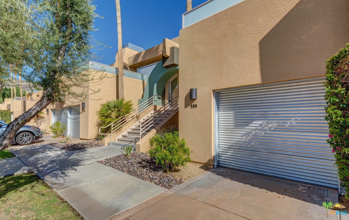 100 East Stevens Road, Unit 509 Palm Springs, CA 92262 - Photo 34 of 37 a view of a house with a yard