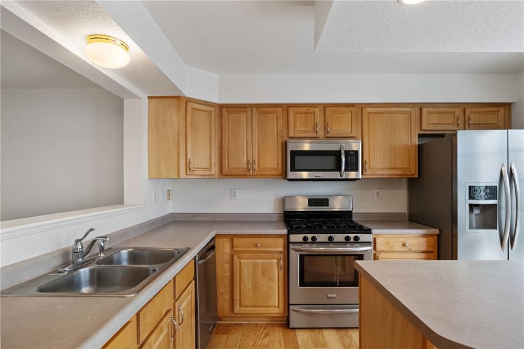 32 Castle View Drive McKees Rocks, PA 15136 - Photo 11 of 34 a kitchen with a sink a stove and refrigerator