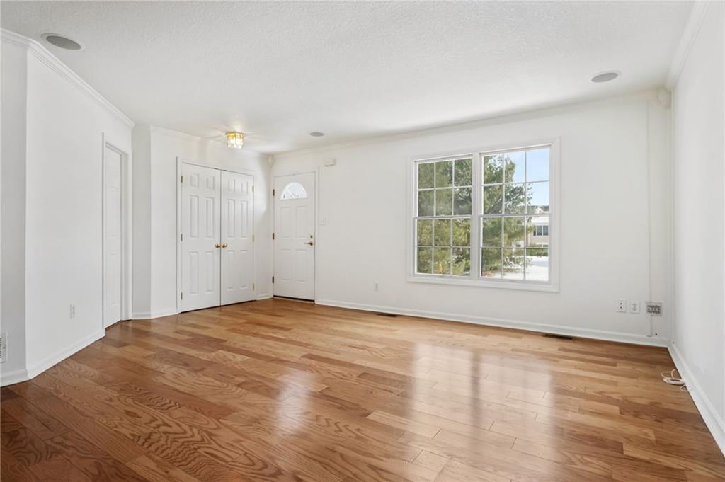 32 Castle View Drive McKees Rocks, PA 15136 - Photo 5 of 34 a view of an empty room with wooden floor and a window