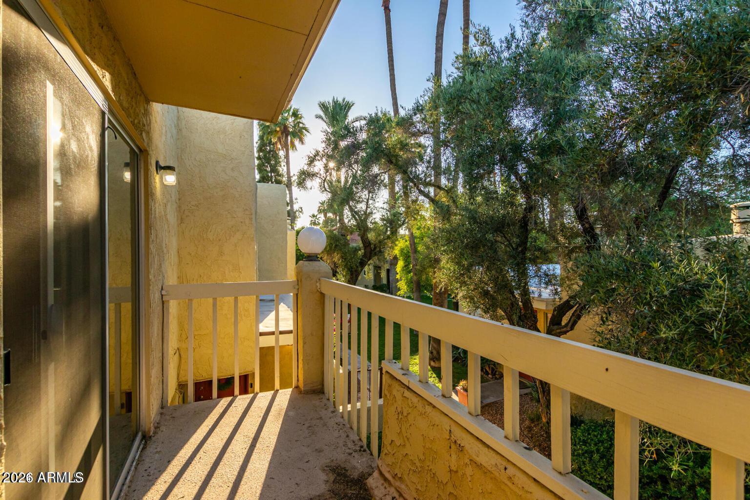 6540 North 7th Avenue, Unit 42 Phoenix, AZ 85013 - Photo 13 of 18 a view of a balcony with wooden floor