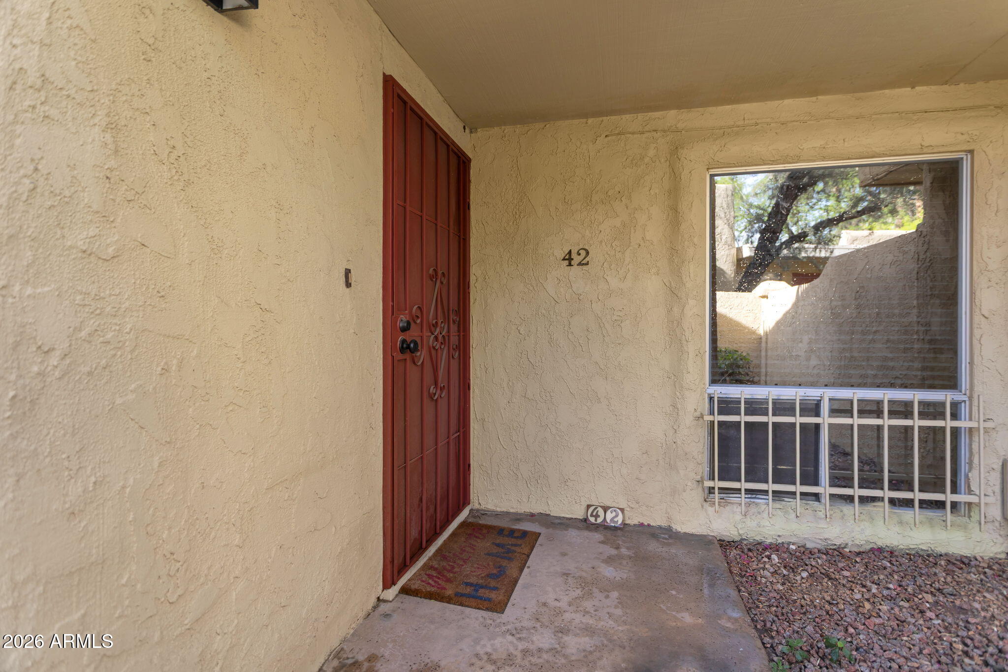 6540 North 7th Avenue, Unit 42 Phoenix, AZ 85013 - Photo 2 of 18 a view of a door and a window