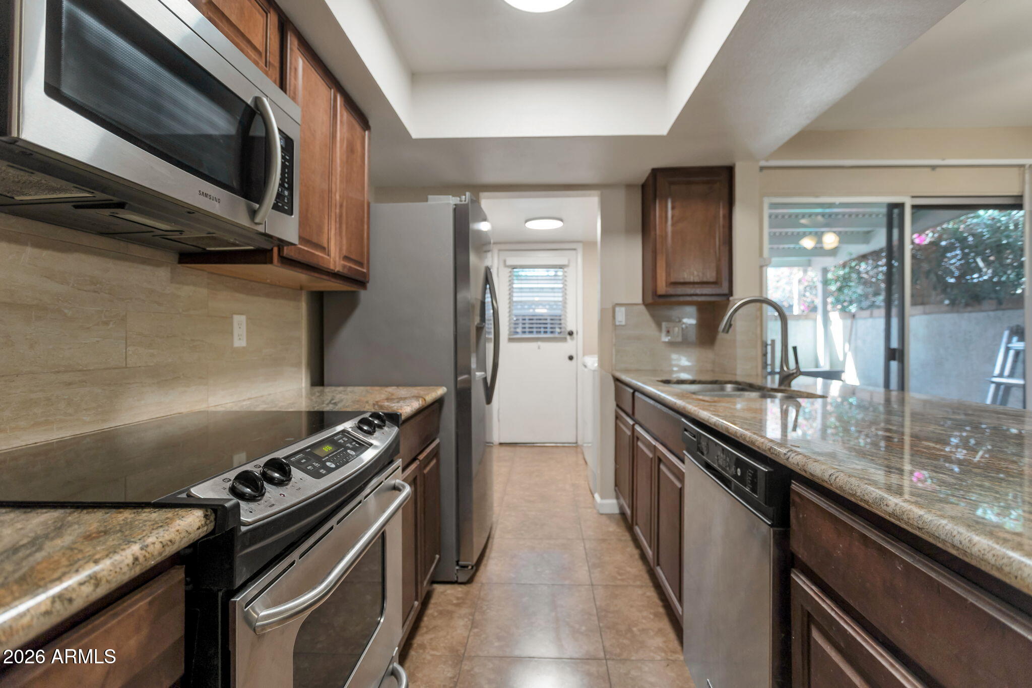 6540 North 7th Avenue, Unit 42 Phoenix, AZ 85013 - Photo 5 of 18 a kitchen with a stove and a sink