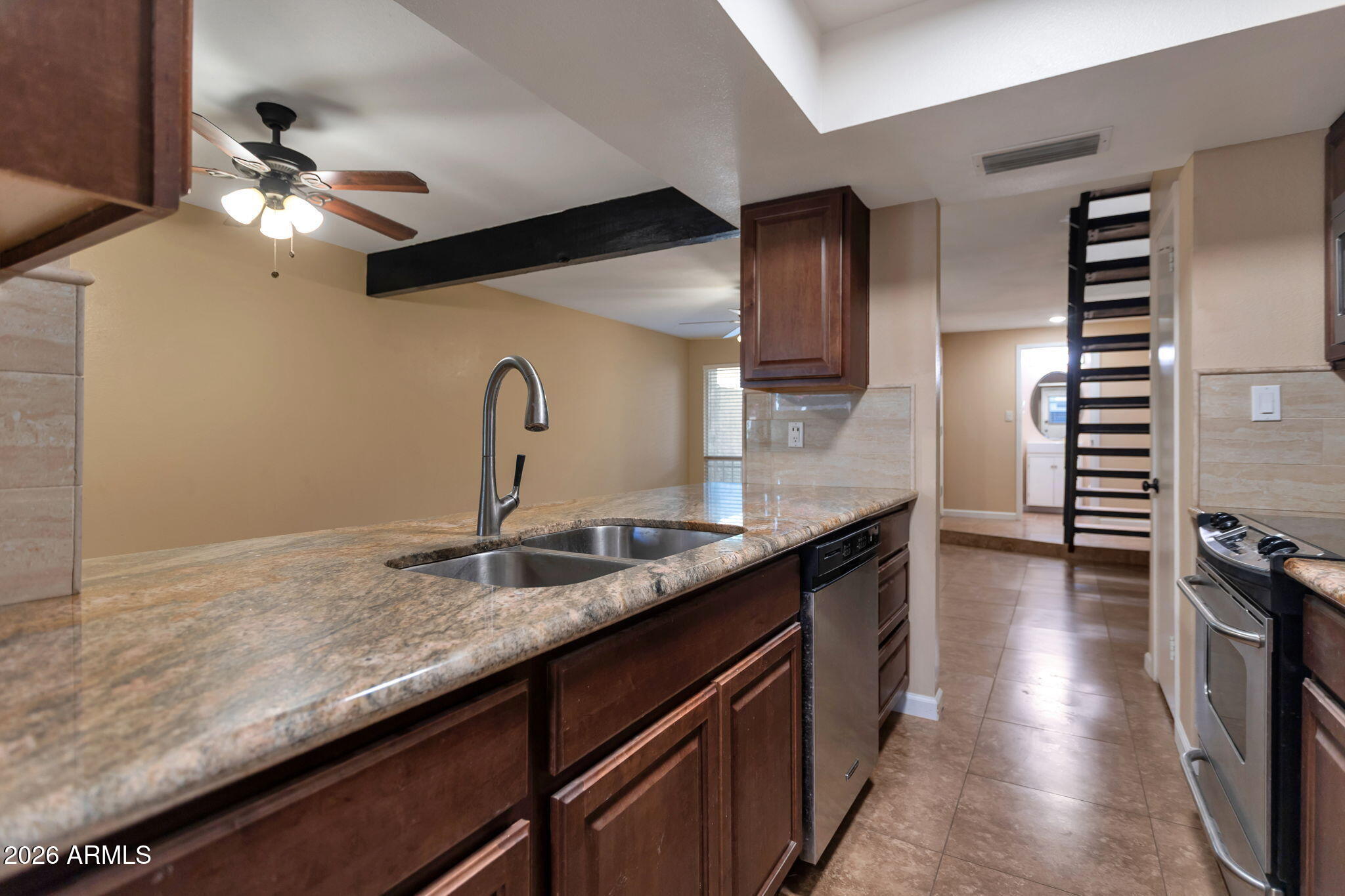 6540 North 7th Avenue, Unit 42 Phoenix, AZ 85013 - Photo 7 of 18 a kitchen with granite countertop a sink and refrigerator