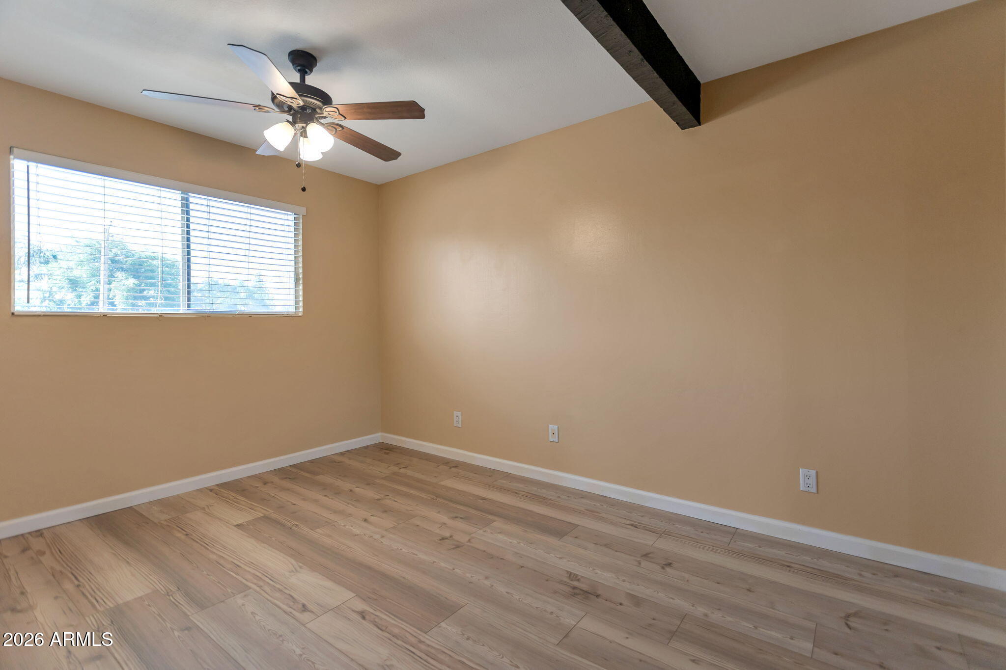 6540 North 7th Avenue, Unit 42 Phoenix, AZ 85013 - Photo 10 of 18 a view of a room with wooden floor and fan