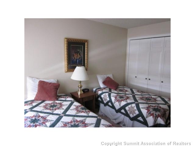 108 Guller Road, Unit A5 Frisco, CO 80443 - Photo 20 of 25 Bedroom. Bedroom #2 currently has twin beds. This room can easily accommodate a king bed, queen bed or two sets of bunk beds!