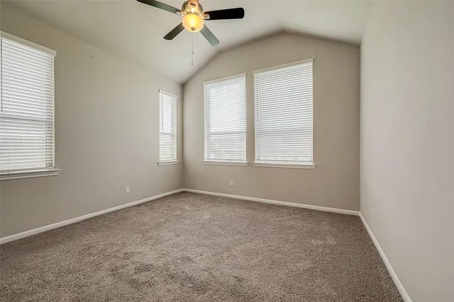 a bathroom with a granite countertop sink a mirror and shower