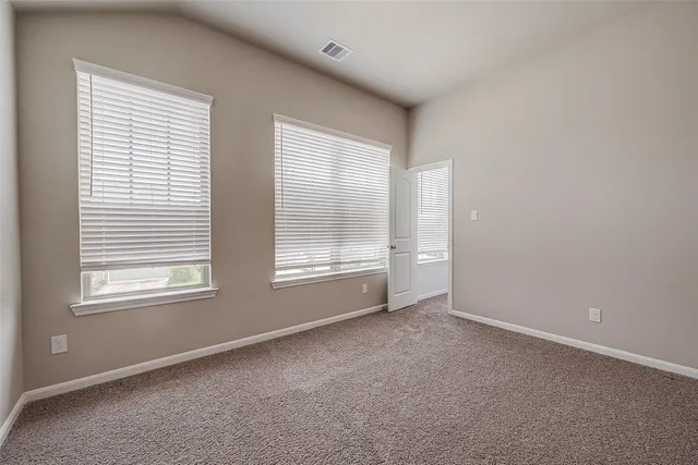 a view of an empty room and closet