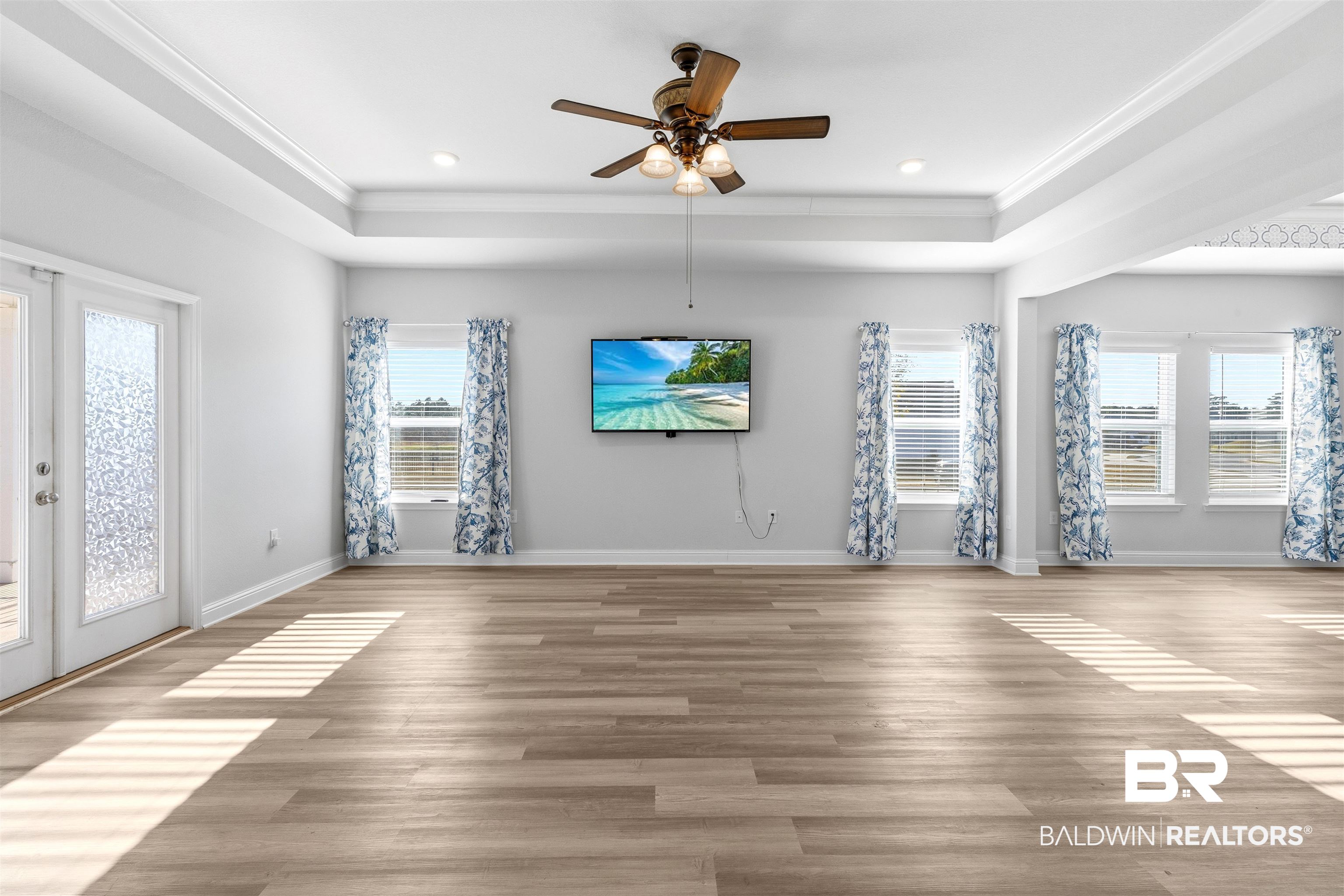 485 Shepard Street Gulf Shores, AL 36542 - Photo 12 of 53 Unfurnished room featuring french doors, ceiling fan, wood finished floors, and recessed lighting