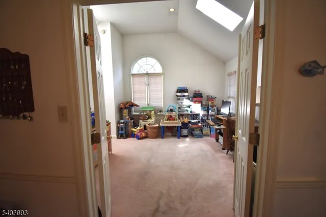 a view of living room with furniture and a window