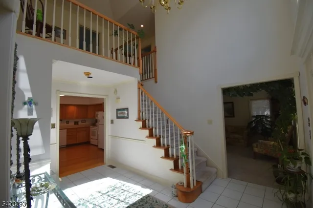 a view of entryway and hall with a workspace
