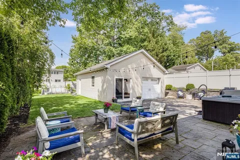 a view of a backyard with sitting area