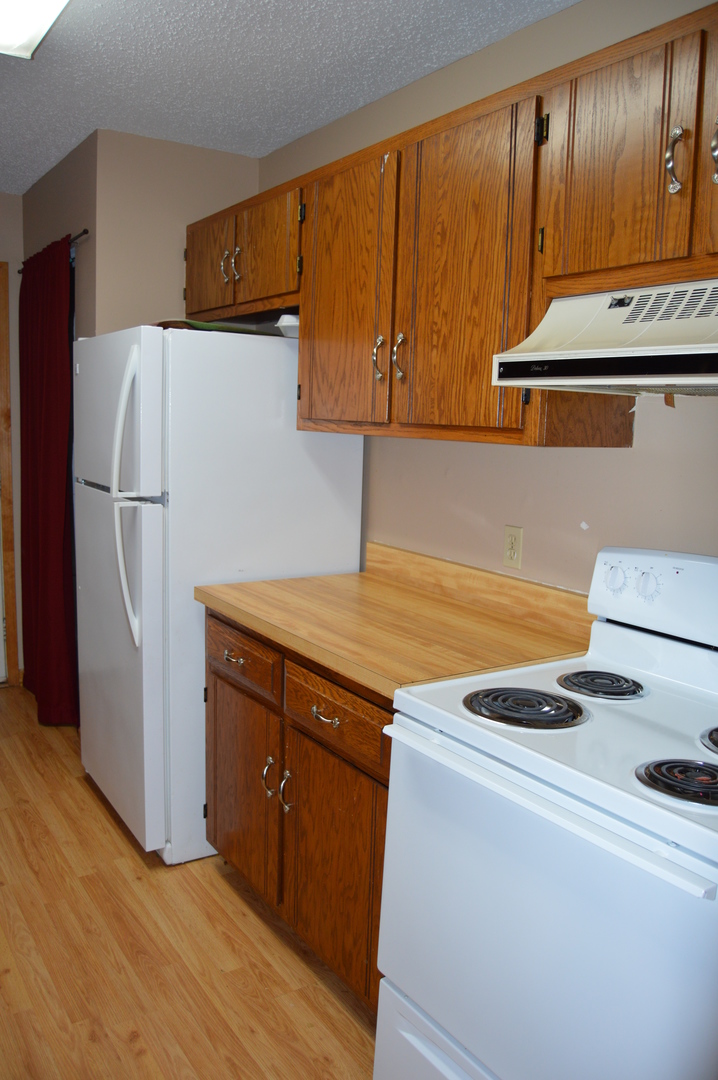 1260 Deerpath Drive Morris, IL 60450 - Photo 6 of 13 a kitchen with a refrigerator and a stove top oven