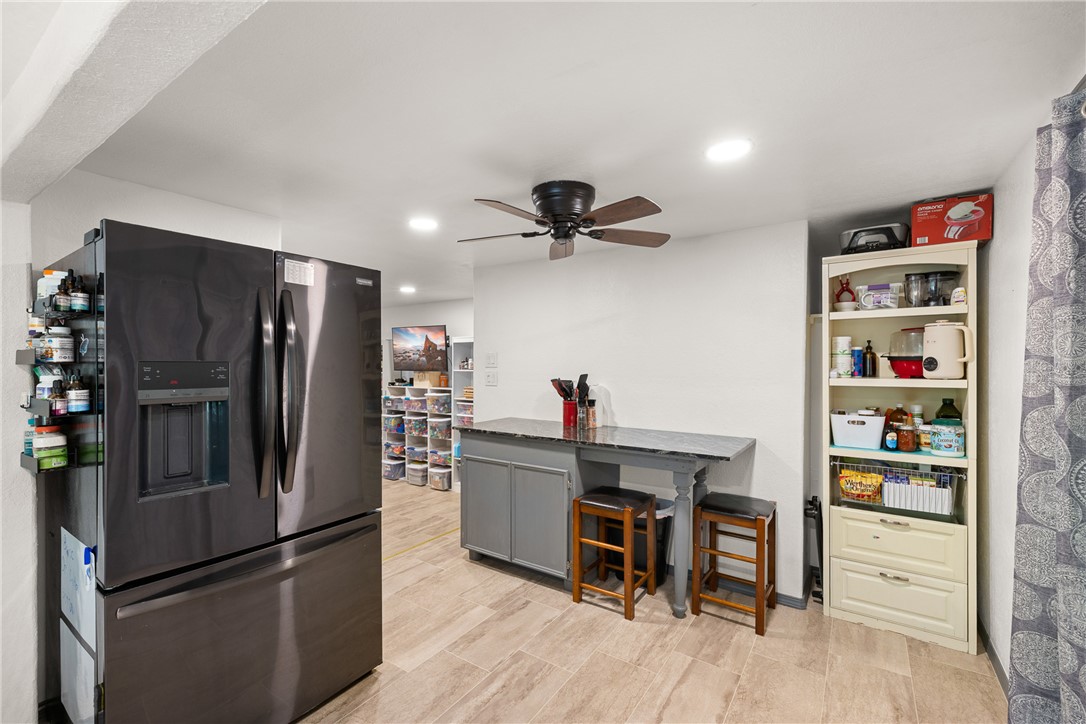 12255 County Road Centerville, TX 75833 - Photo 5 of 26 a kitchen with stainless steel appliances a refrigerator and a wooden floor