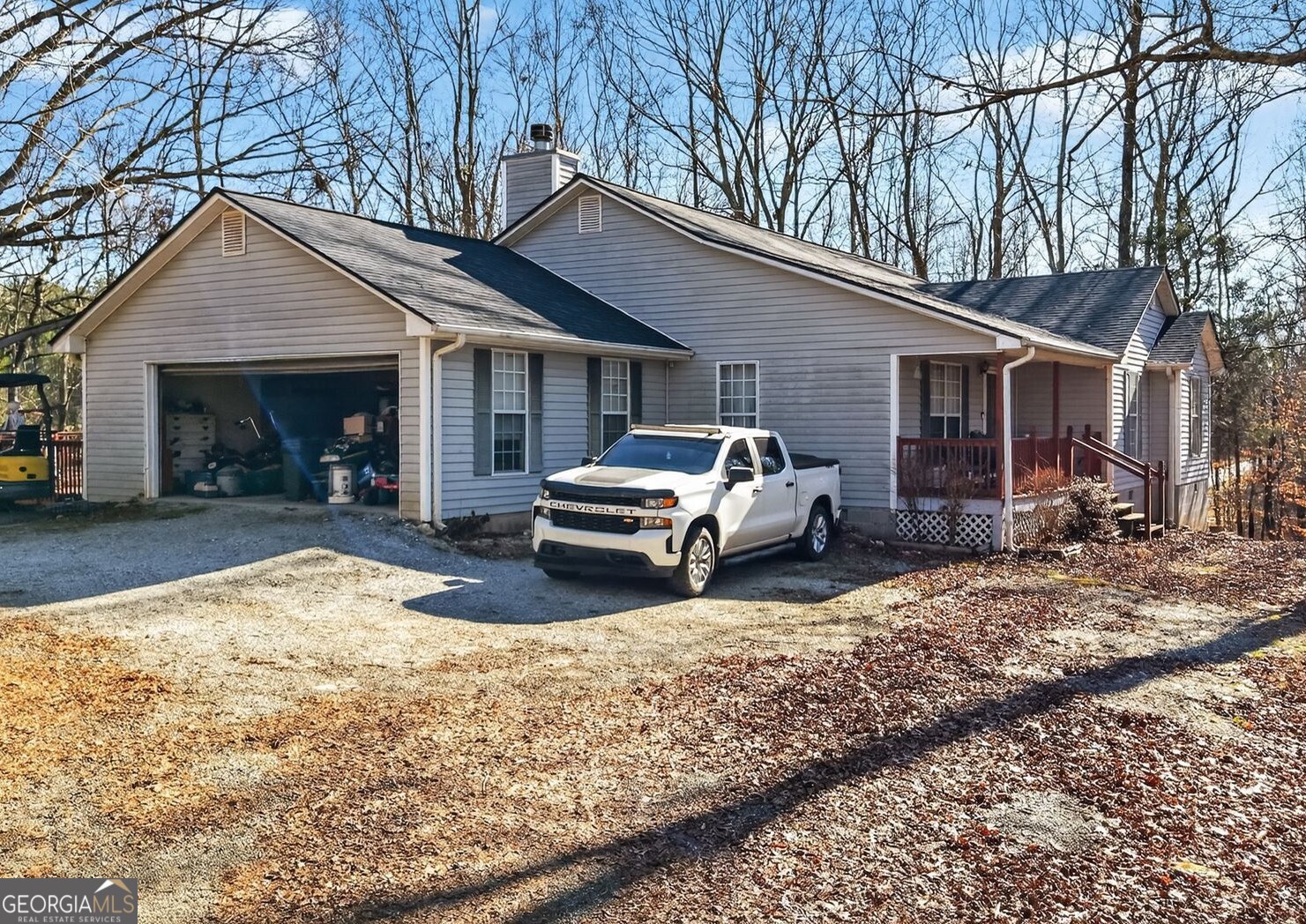 a view of a house with a yard covered in snow