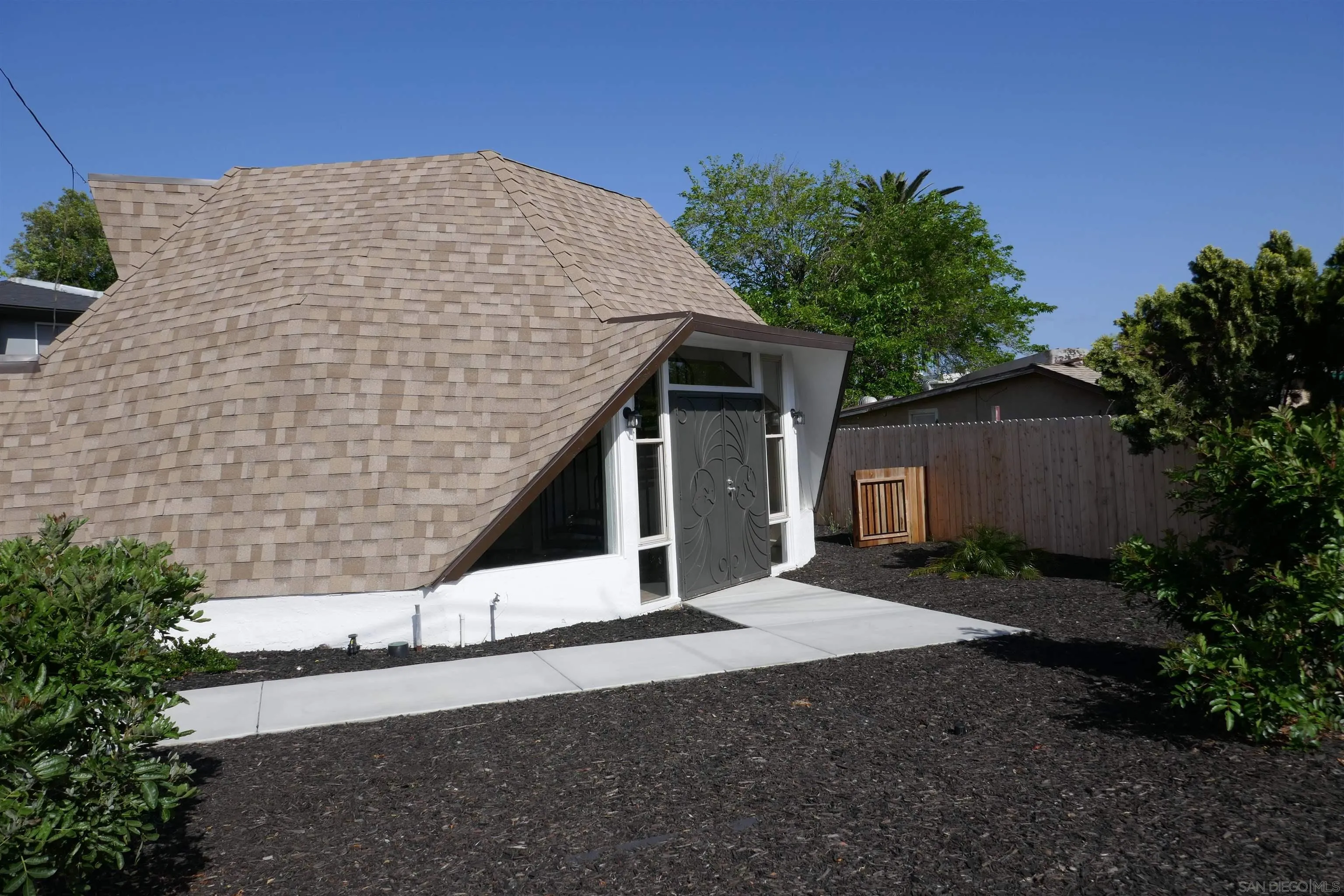 1015 Oro Street El Cajon, CA 92021 - Photo 2 of 14 a house with trees in front of it