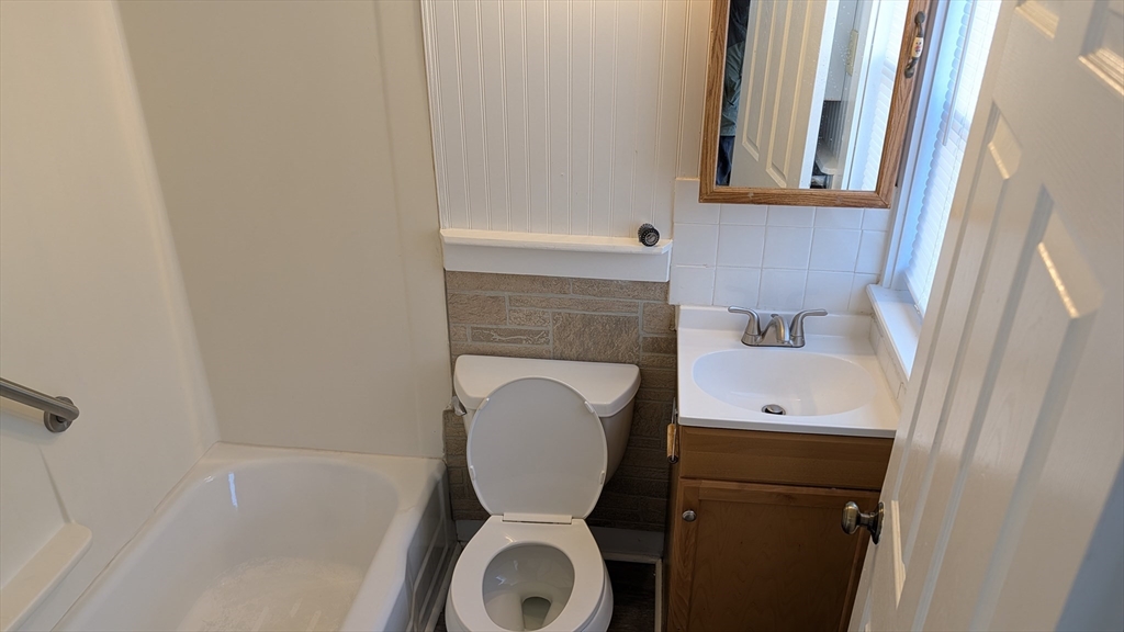 92 North Franklin Street, Unit 1 Holbrook, MA 02343 - Photo 17 of 25 a bathroom with a toilet and a sink