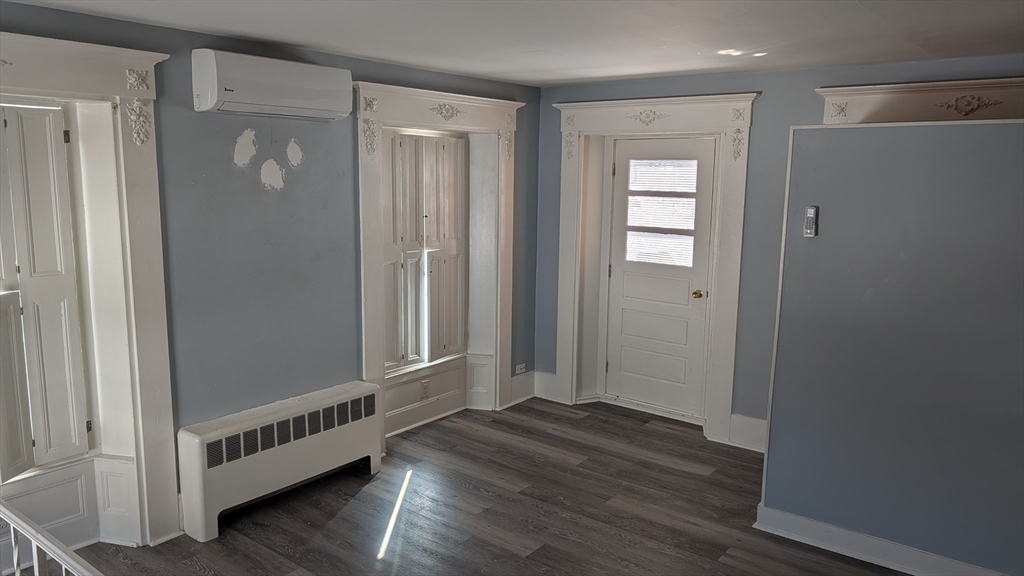 92 North Franklin Street, Unit 1 Holbrook, MA 02343 - Photo 18 of 25 a view of a hallway with wooden floor