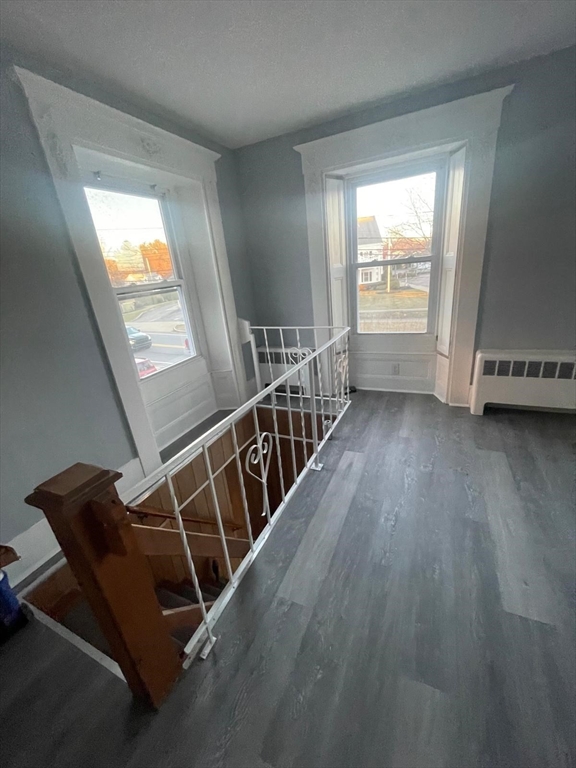 92 North Franklin Street, Unit 1 Holbrook, MA 02343 - Photo 6 of 25 wooden floor in an empty room with a window
