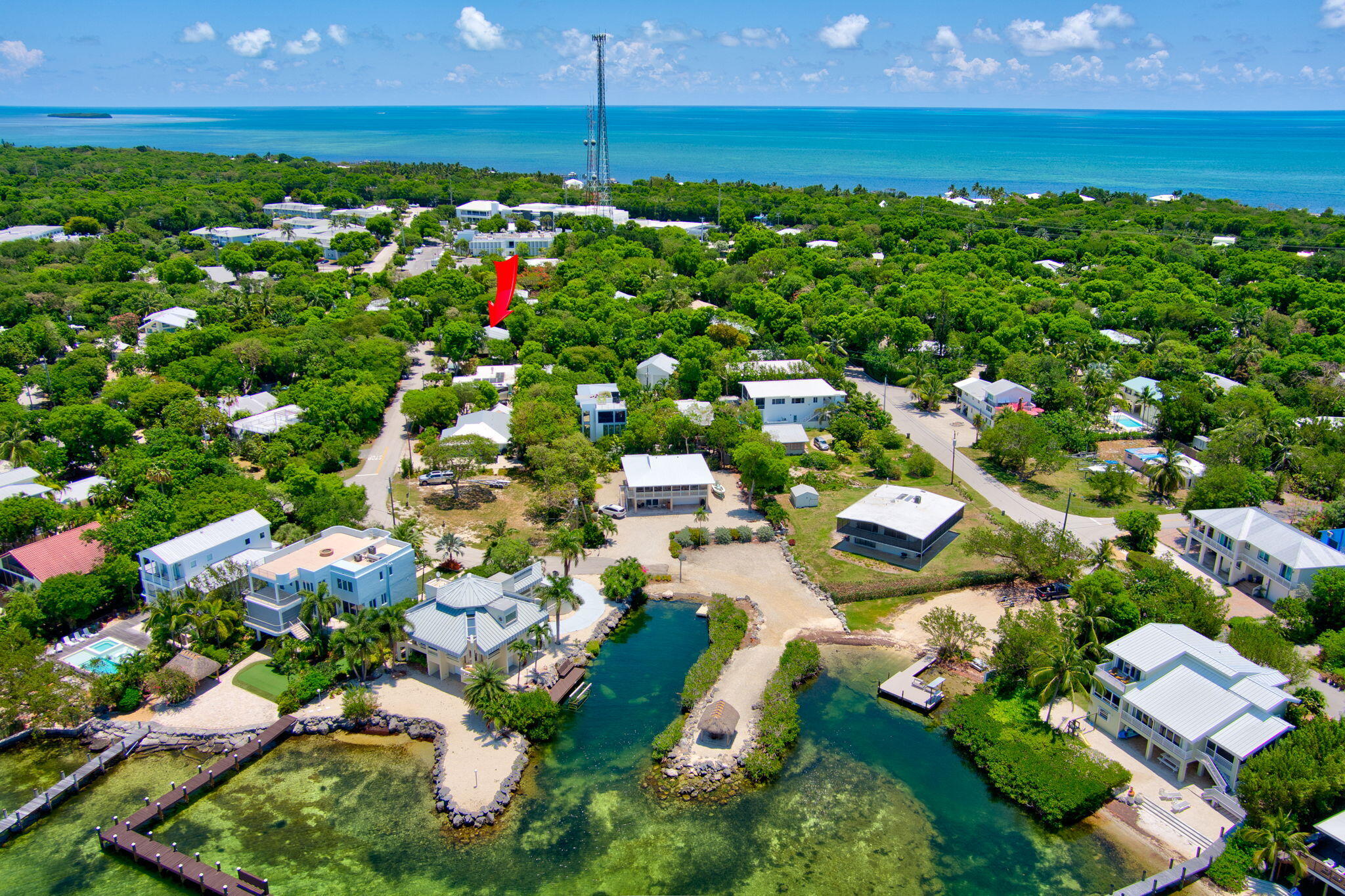 125 South Rolling Hill Road Tavernier, FL 33070 - Photo 1 of 48 an aerial view of residential houses with outdoor space and trees all around
