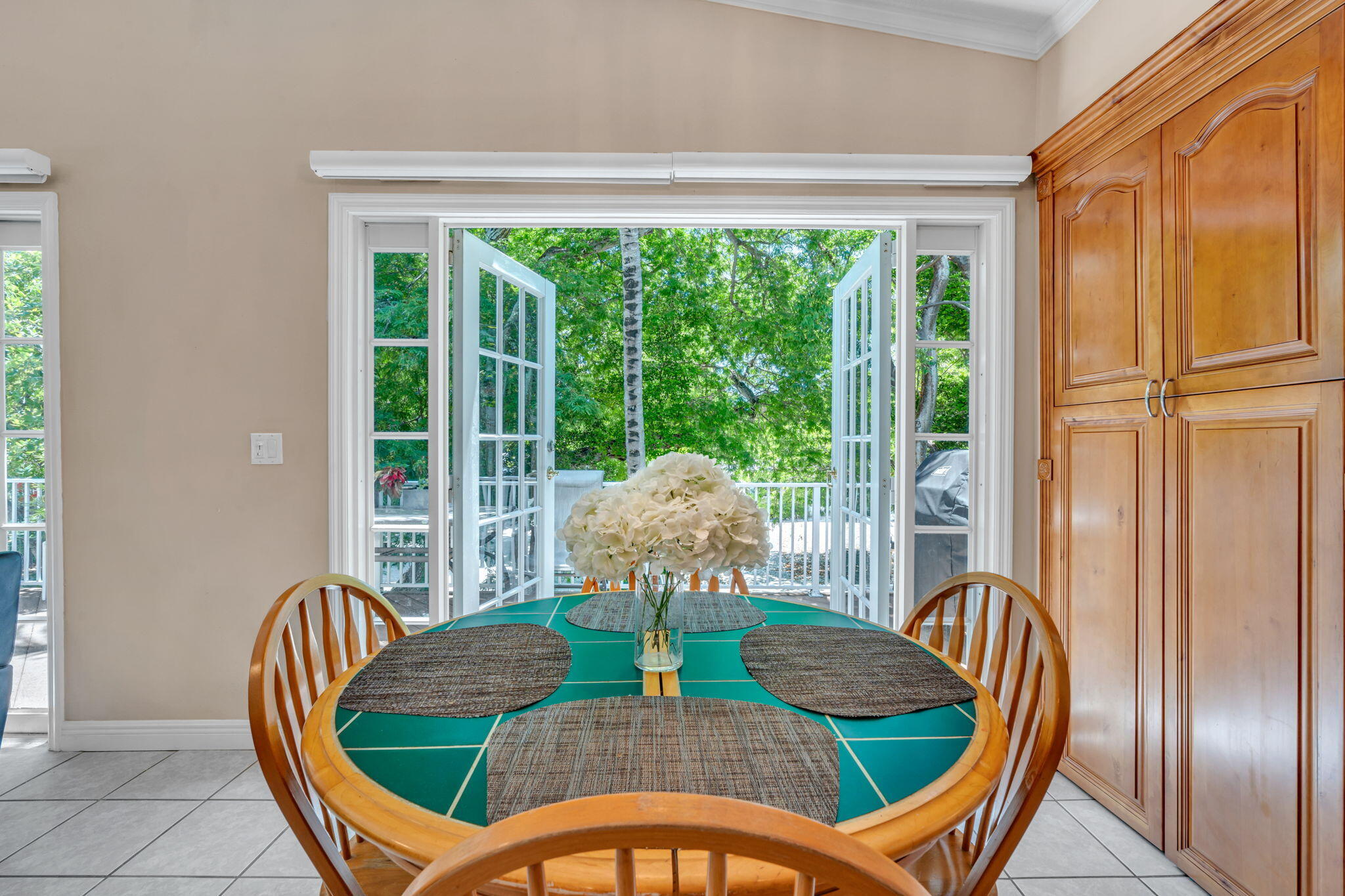 125 South Rolling Hill Road Tavernier, FL 33070 - Photo 10 of 48 a view of a dining room with furniture window and outside view