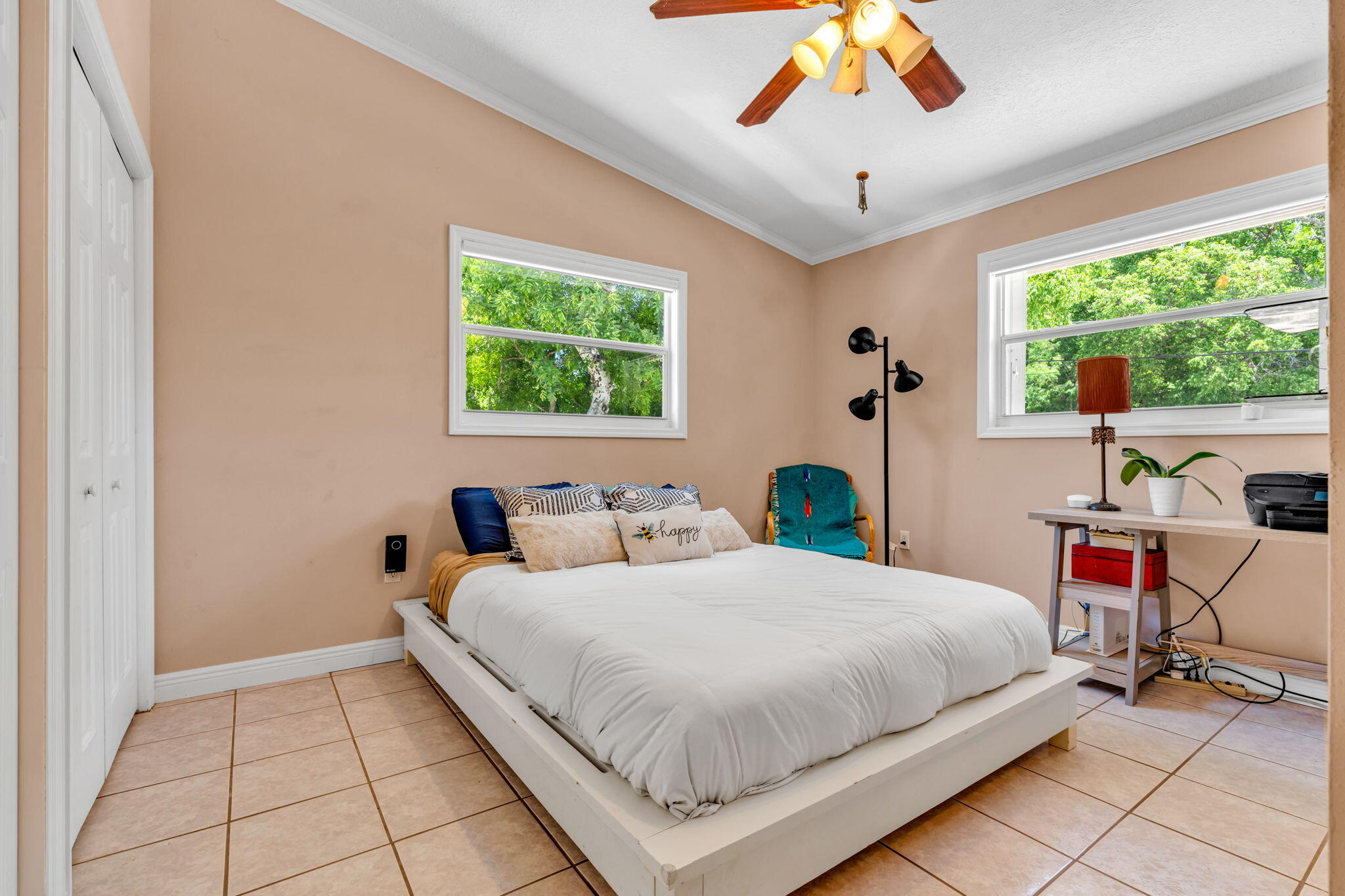 125 South Rolling Hill Road Tavernier, FL 33070 - Photo 21 of 48 a bedroom with a bed and a chandelier