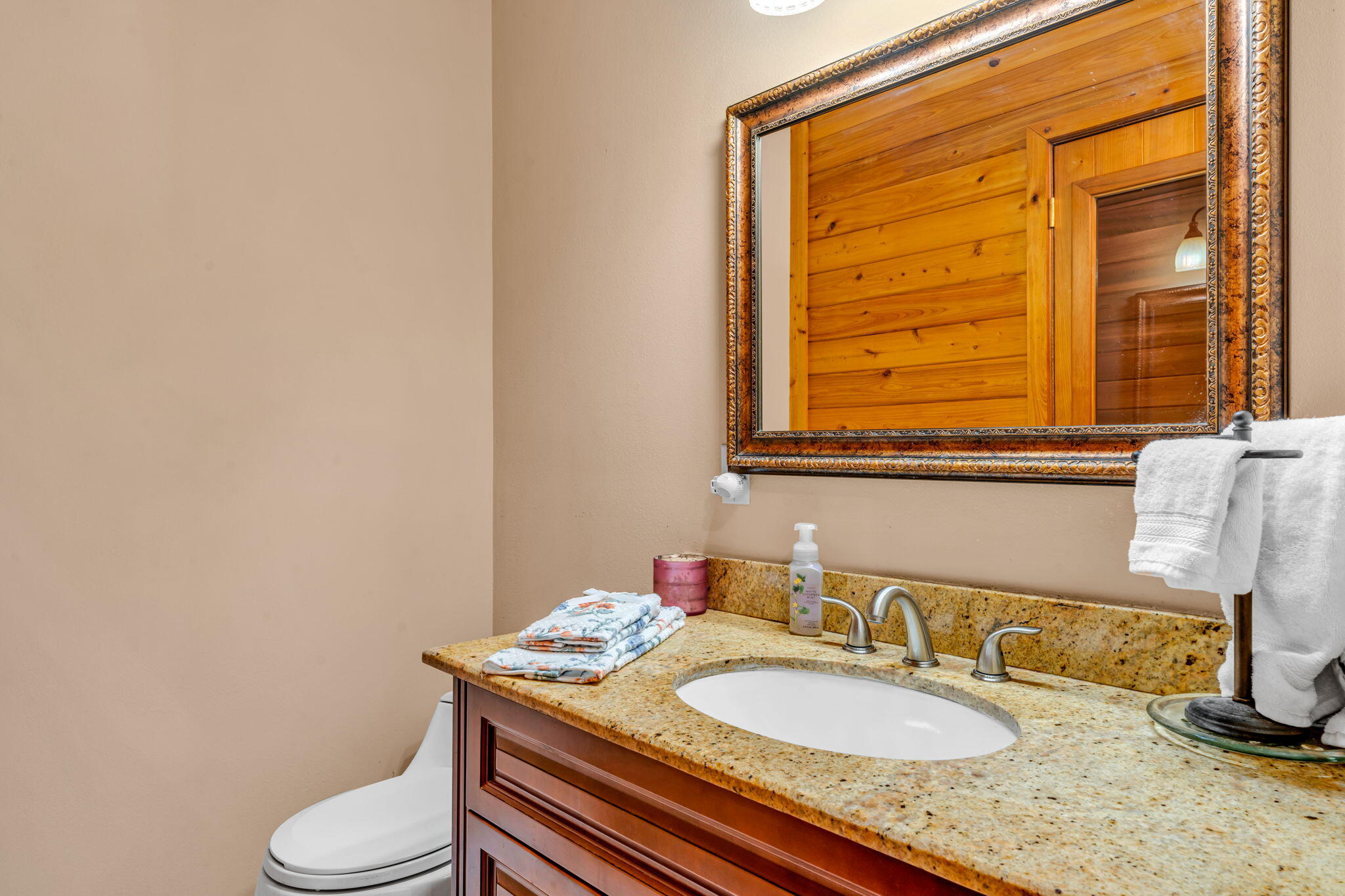 125 South Rolling Hill Road Tavernier, FL 33070 - Photo 24 of 48 a bathroom with a granite countertop toilet sink and mirror