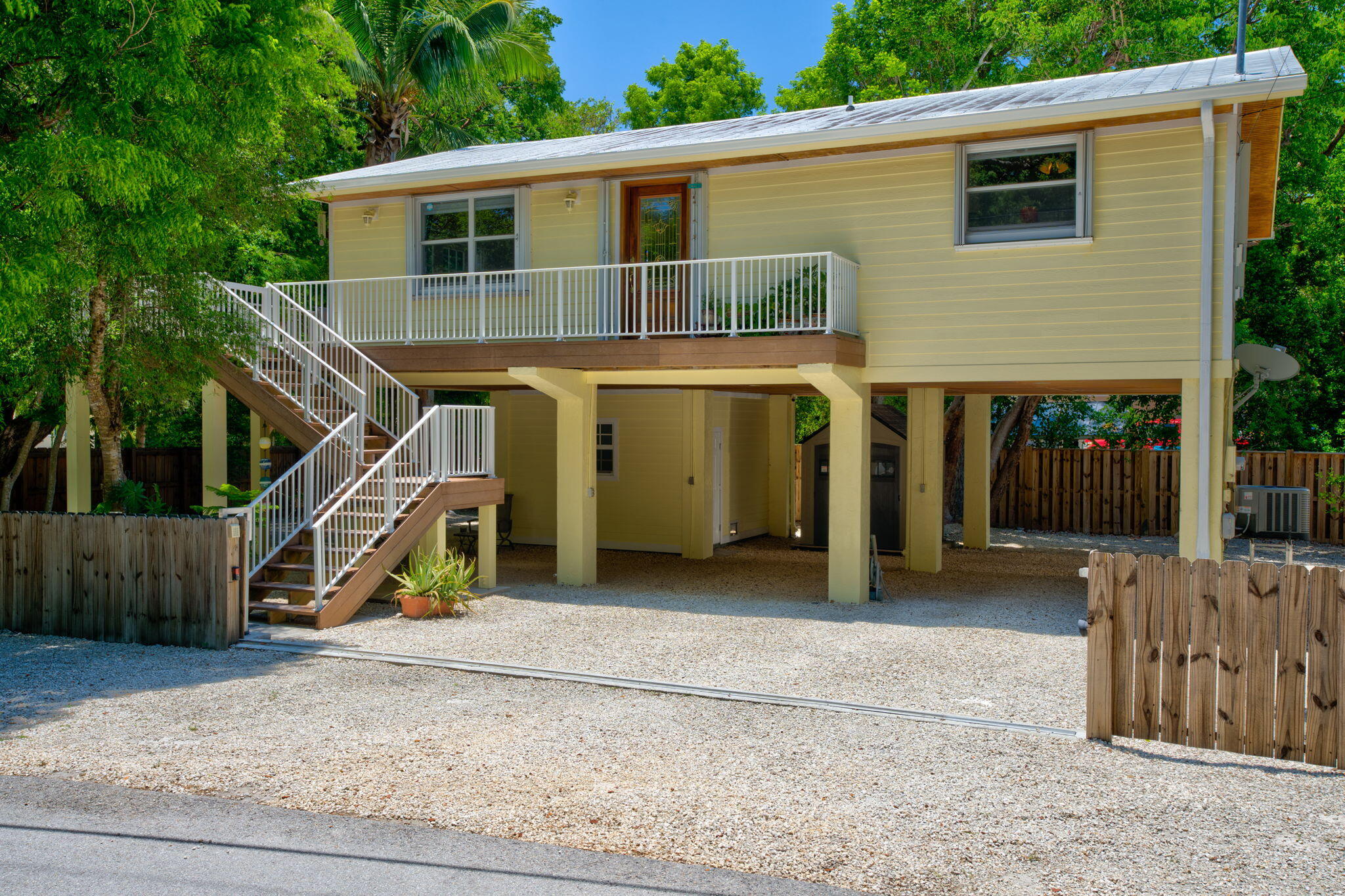 125 South Rolling Hill Road Tavernier, FL 33070 - Photo 3 of 48 a view of a house with a patio