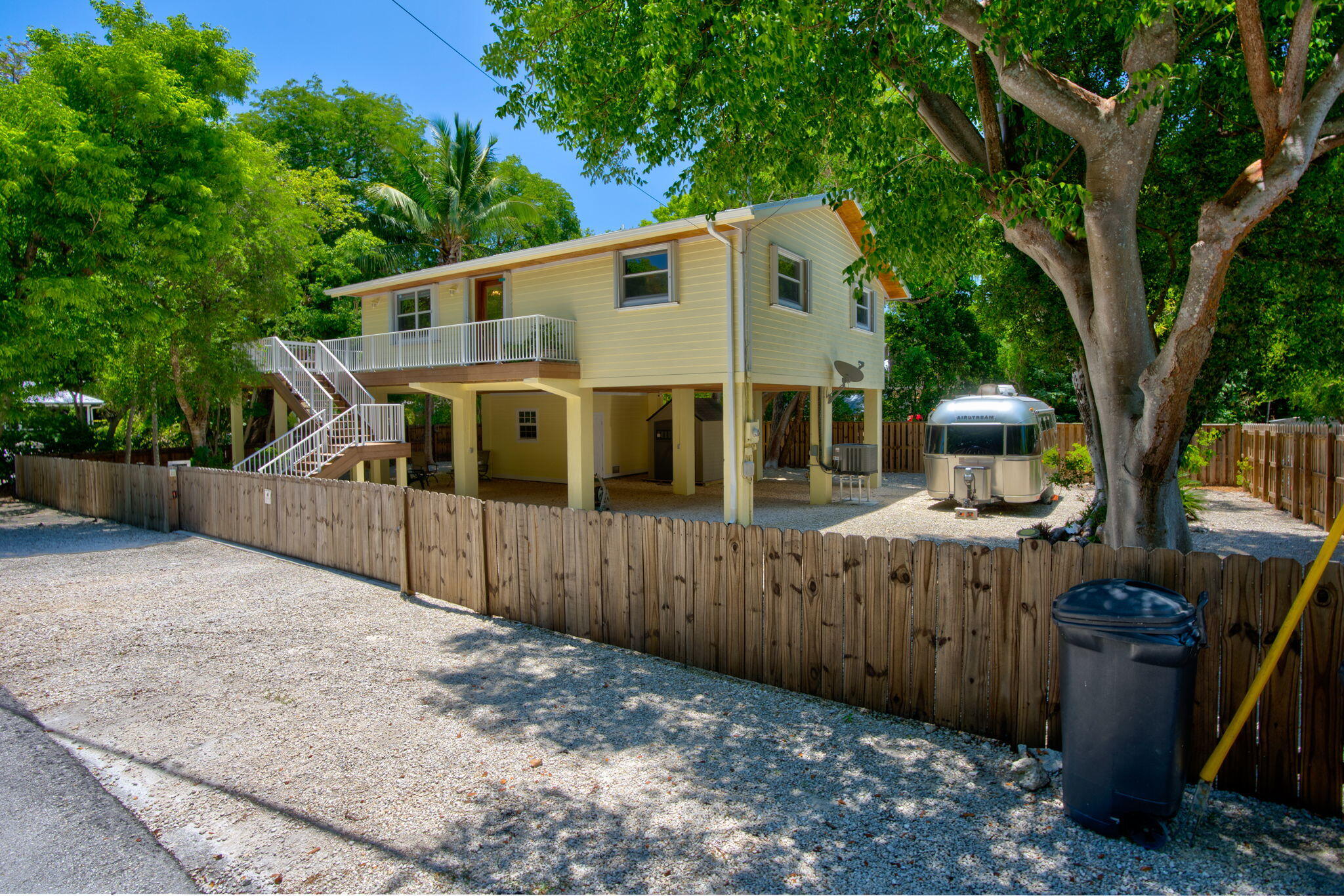 125 South Rolling Hill Road Tavernier, FL 33070 - Photo 35 of 48 a front view of a house with a garden