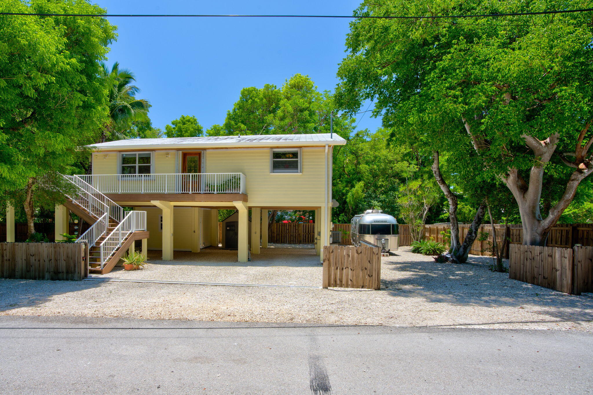 125 South Rolling Hill Road Tavernier, FL 33070 - Photo 38 of 48 a front view of a house with a yard