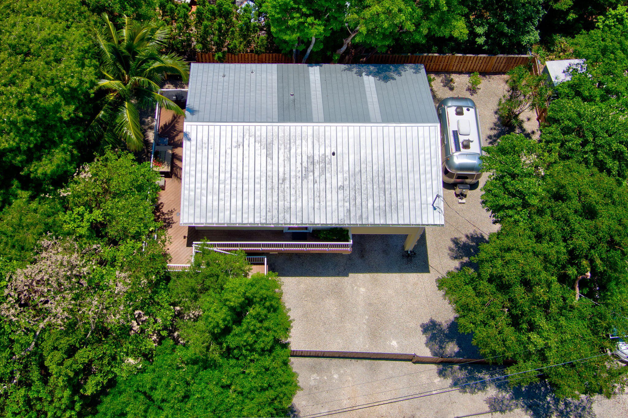 125 South Rolling Hill Road Tavernier, FL 33070 - Photo 40 of 48 an aerial view of a house with a garden