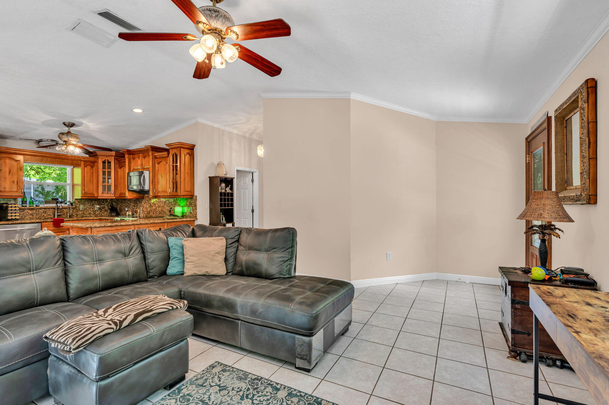 125 South Rolling Hill Road Tavernier, FL 33070 - Photo 5 of 48 a living room with furniture and a chandelier