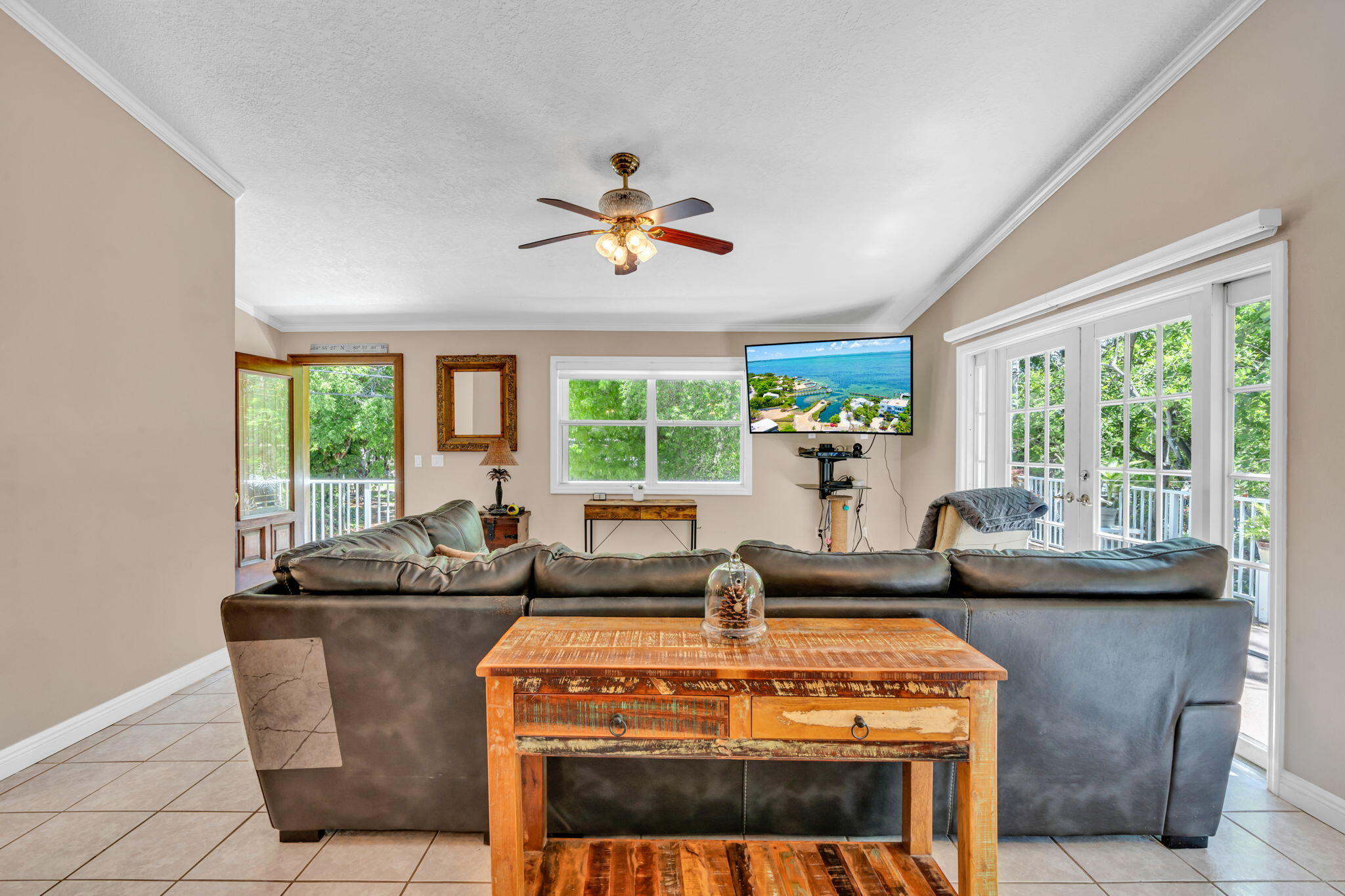 125 South Rolling Hill Road Tavernier, FL 33070 - Photo 6 of 48 a living room with fireplace furniture and a large window