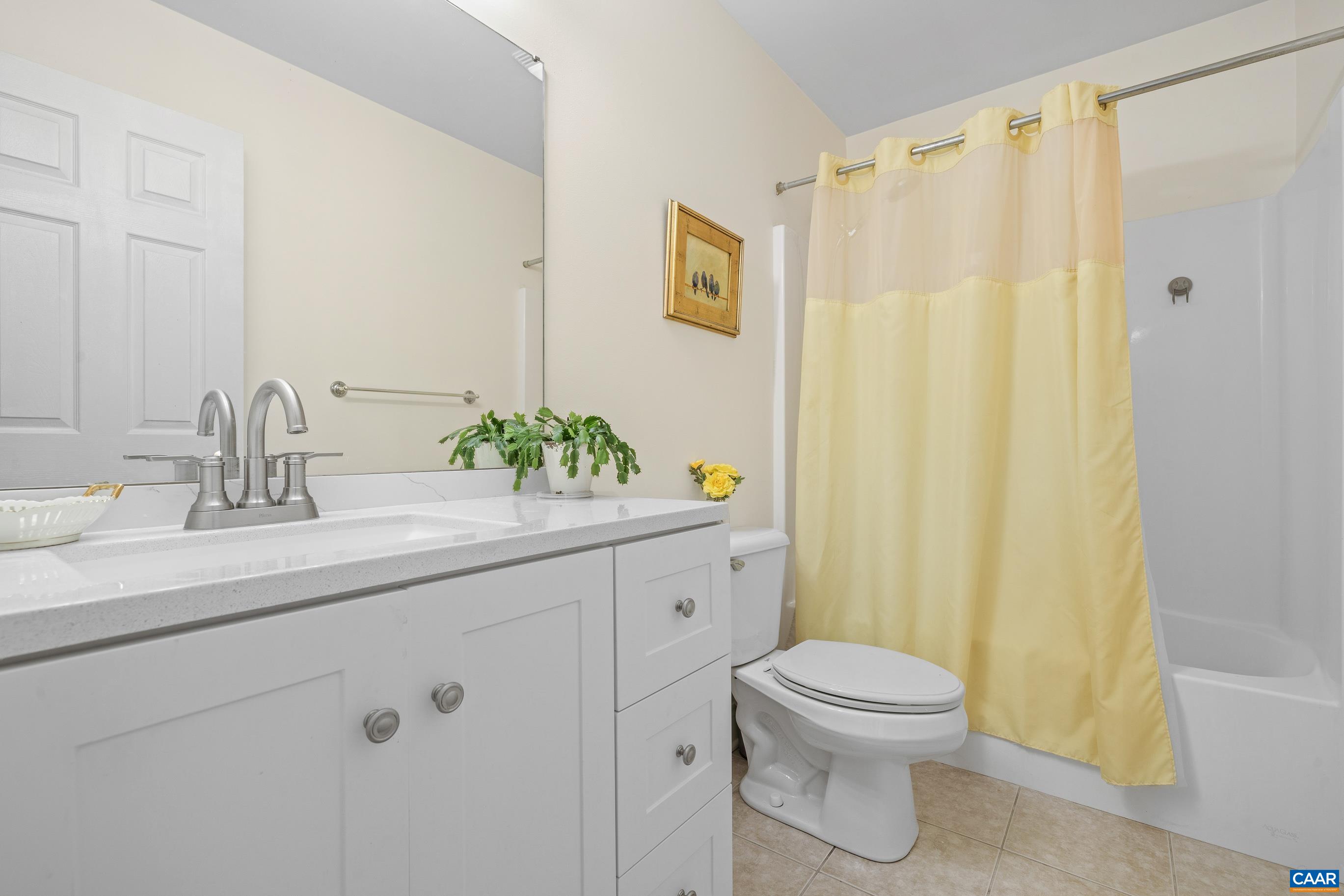 1236 Amber Ridge Road Charlottesville, VA 22901 - Photo 30 of 56 a bathroom with a granite countertop sink a toilet and a mirror