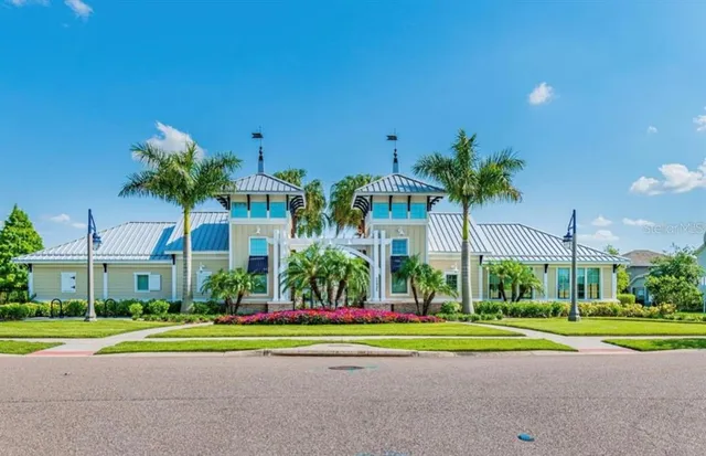 a view of a house with a yard porch and sitting area
