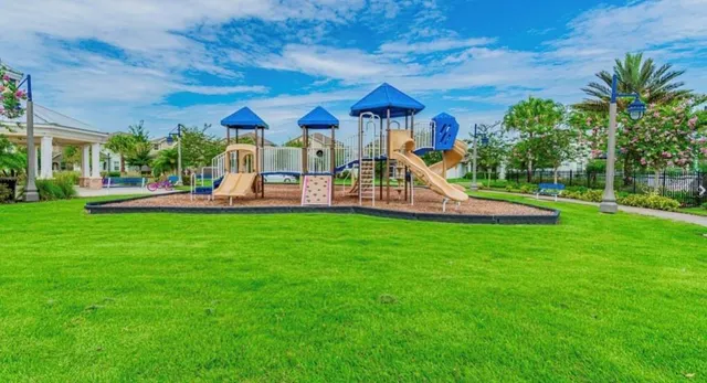 a view of a house with a yard and sitting area