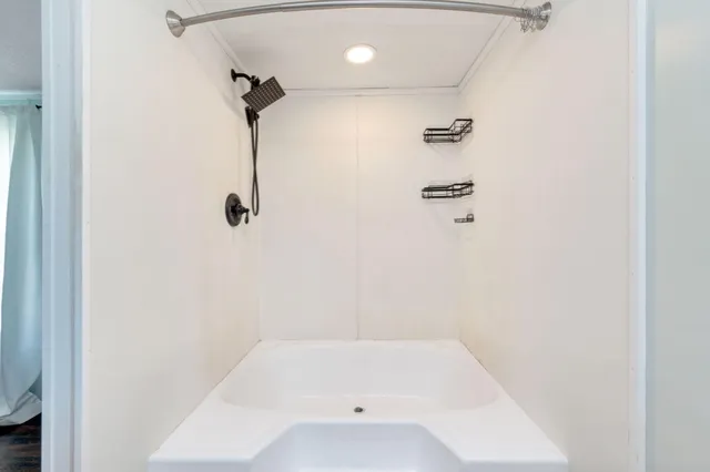 a bathroom with a bath tub