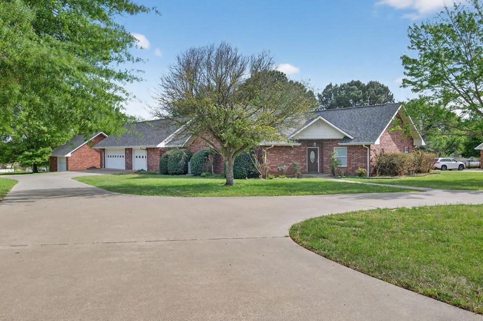 2436 Lakefront Shores Road Athens, TX 75752 - Photo 1 of 32 a view of house with a big yard and large trees