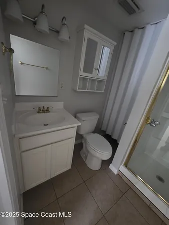 a bathroom with a toilet and a sink