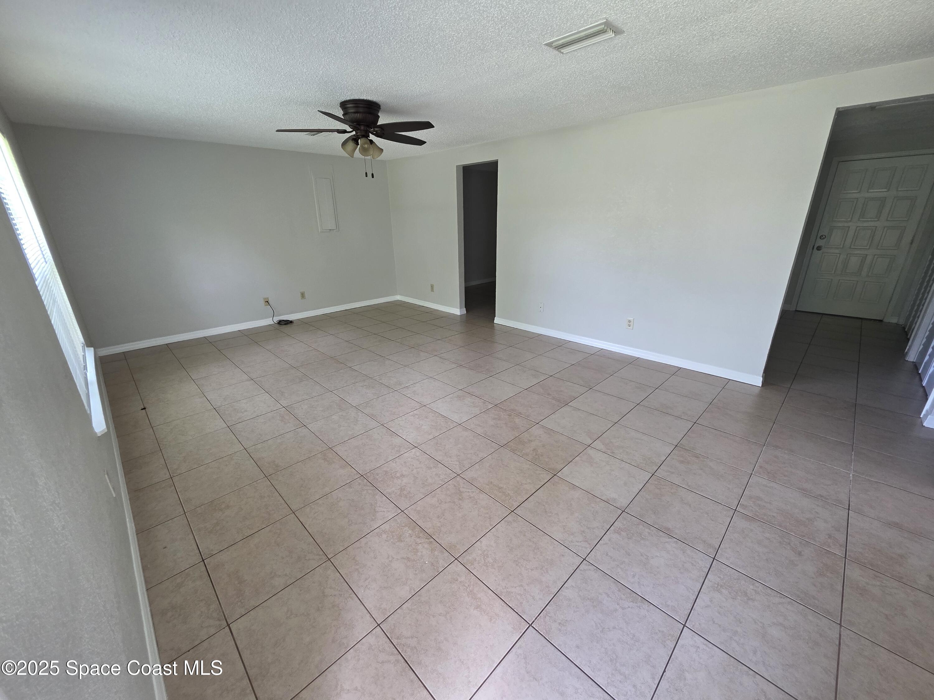 7160 Bevil Avenue Cocoa, FL 32927 - Photo 9 of 10 a view of a room with white cabinets