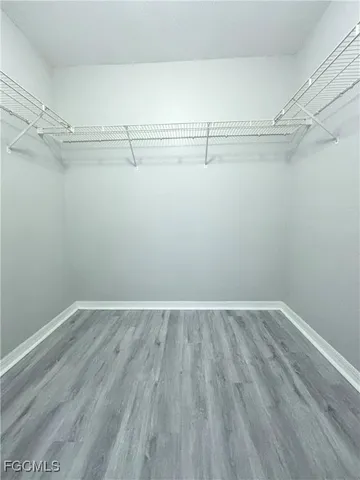 a bathroom with a sink toilet a mirror and shower