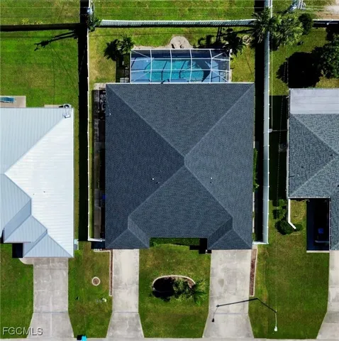 a aerial view of a house with a yard