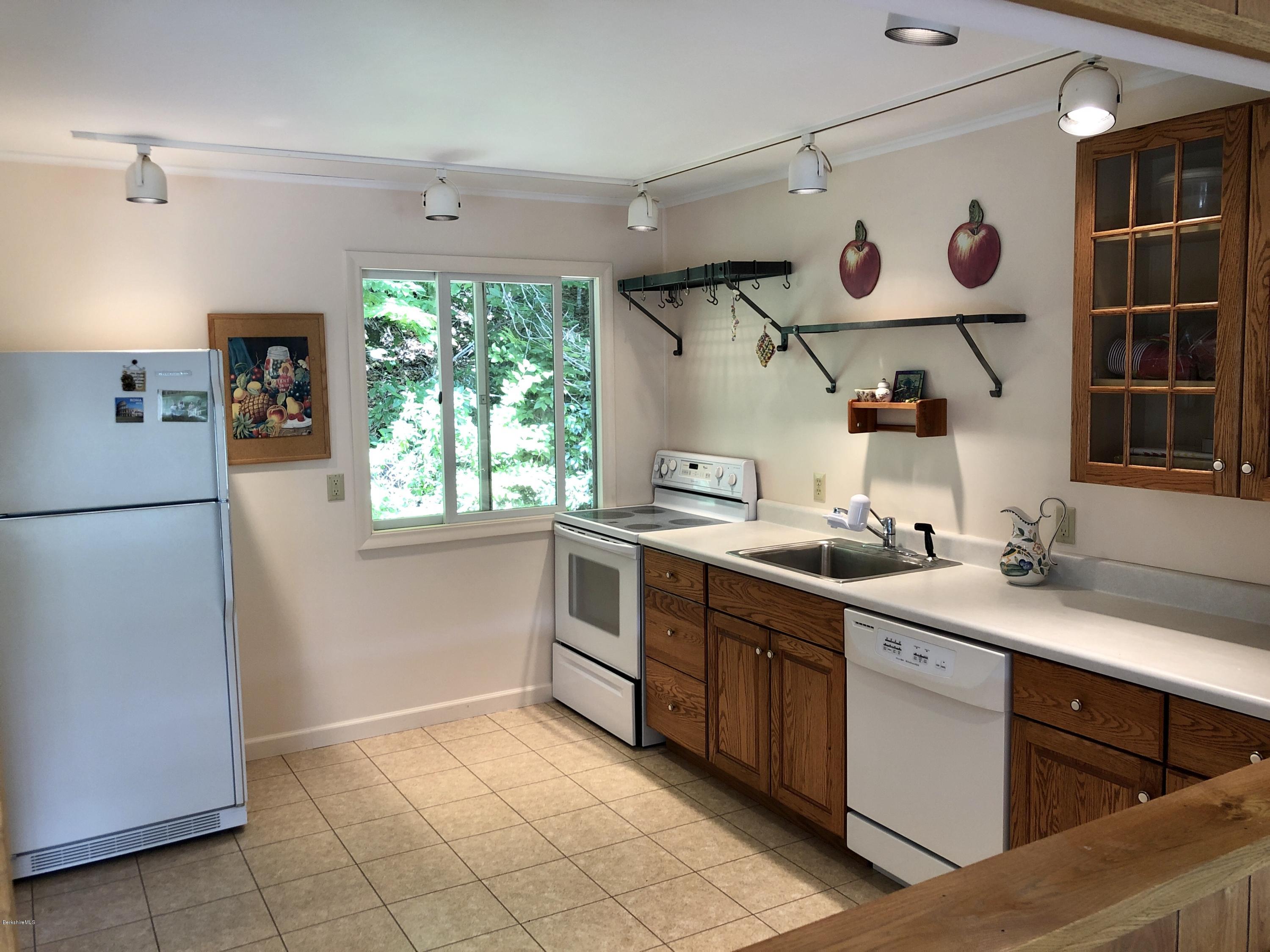 8 Dowd Road Monterey, MA 01245 - Photo 11 of 25 a kitchen with stainless steel appliances granite countertop a sink and a refrigerator