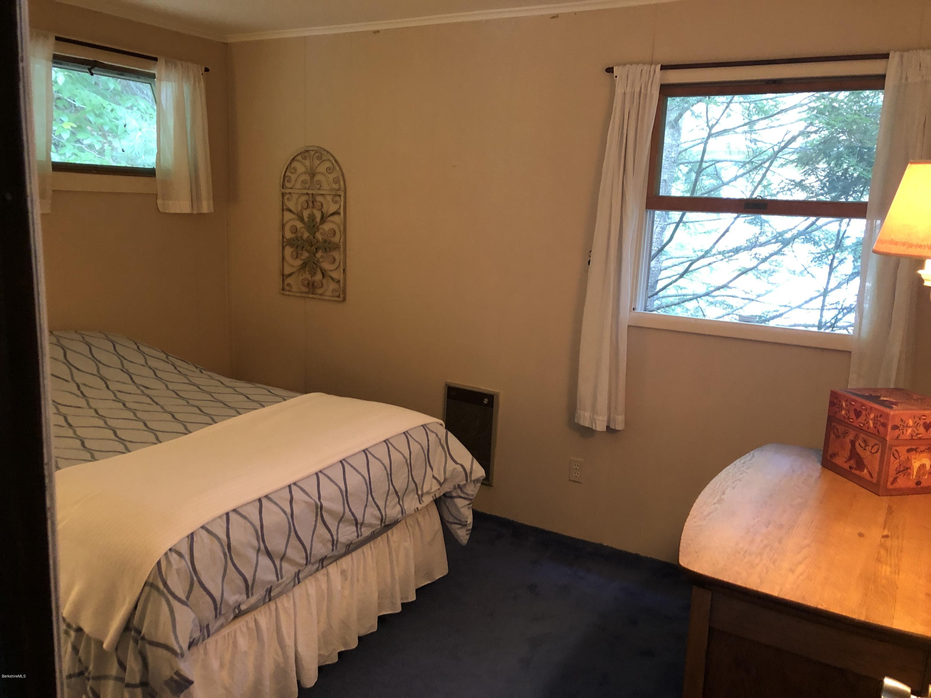 8 Dowd Road Monterey, MA 01245 - Photo 14 of 25 a bedroom with a bed and window