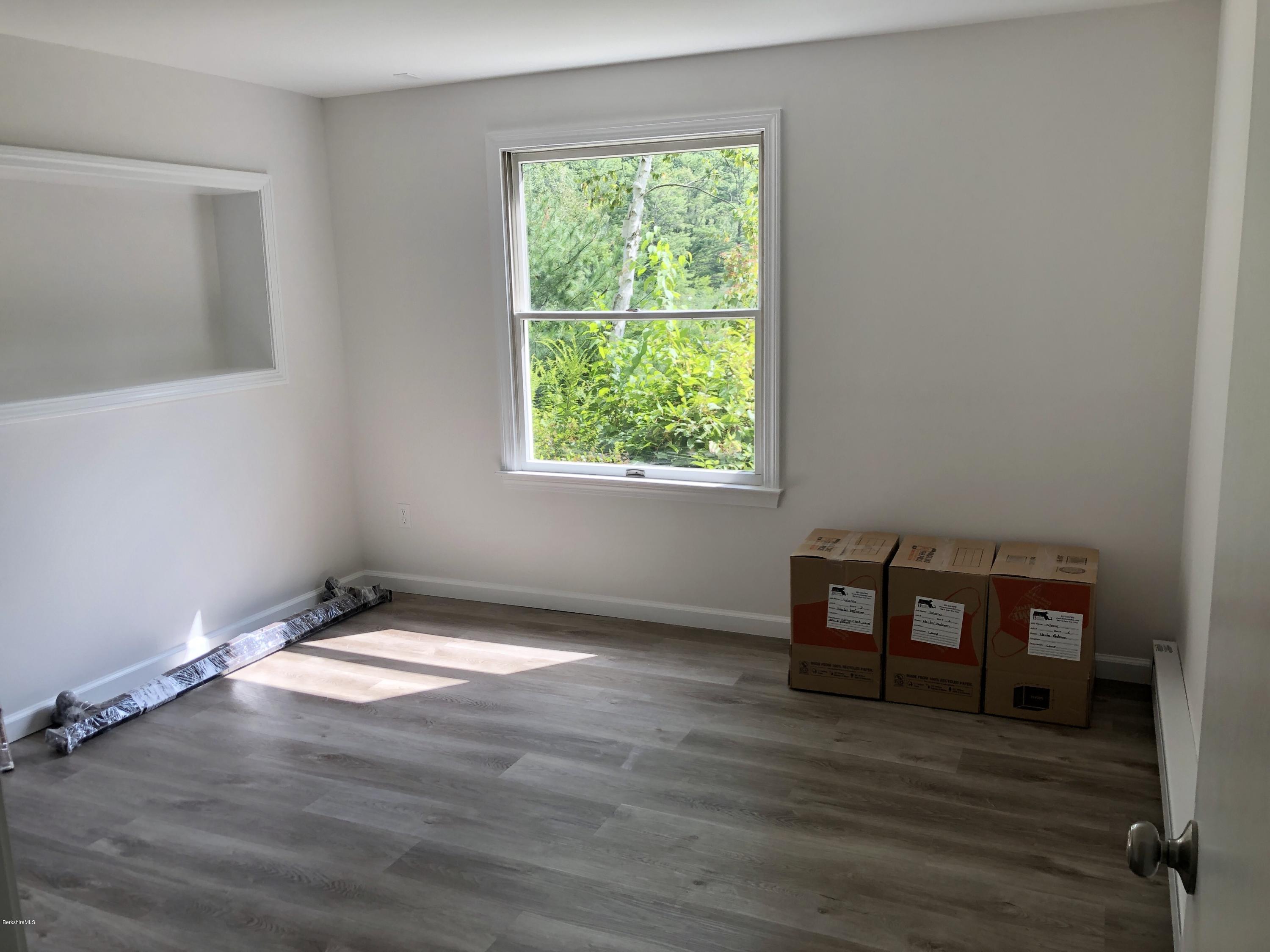 8 Dowd Road Monterey, MA 01245 - Photo 15 of 25 a view of an empty room with wooden floor and a window