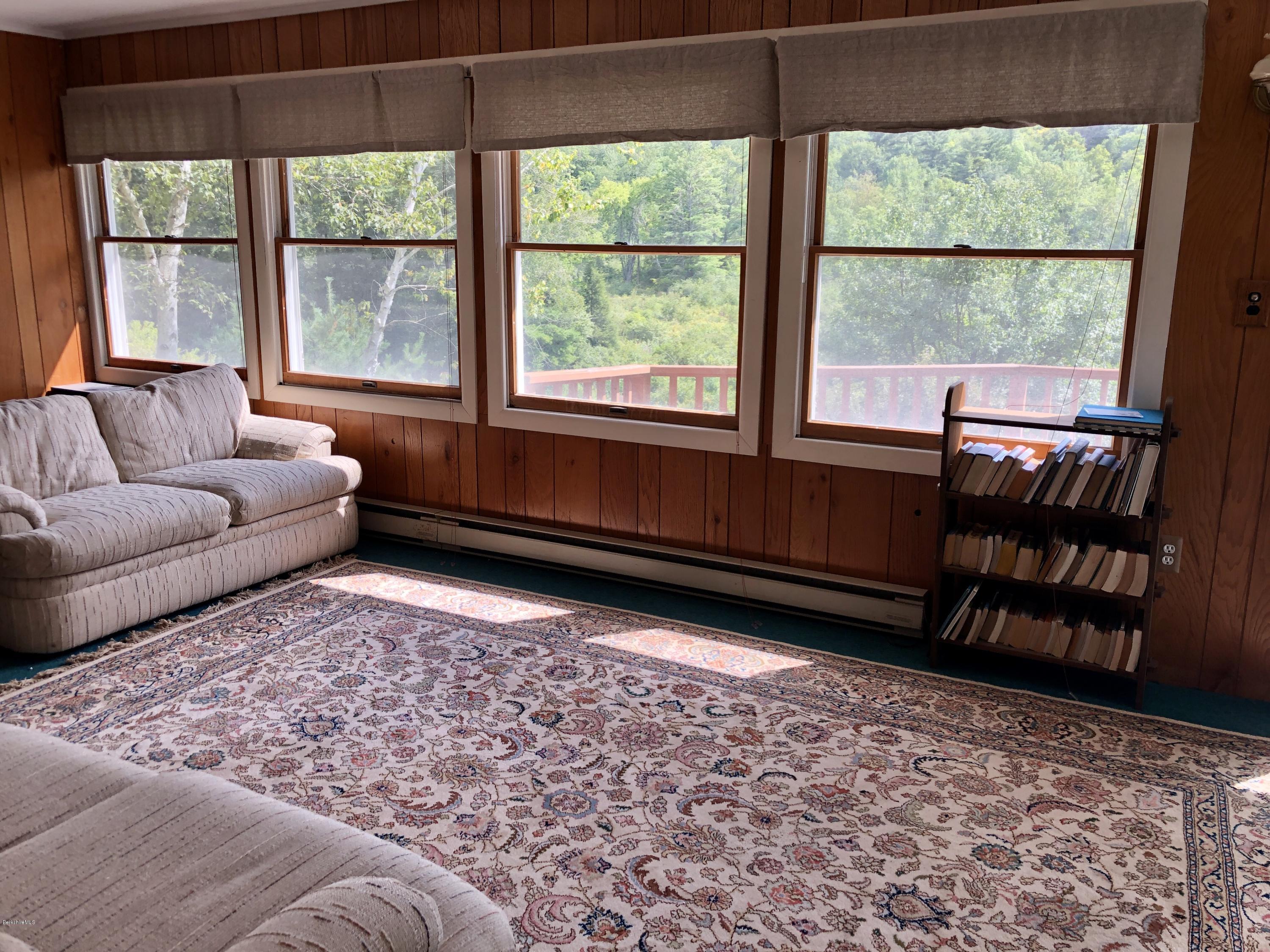 8 Dowd Road Monterey, MA 01245 - Photo 8 of 25 a living room with a large window and a rug