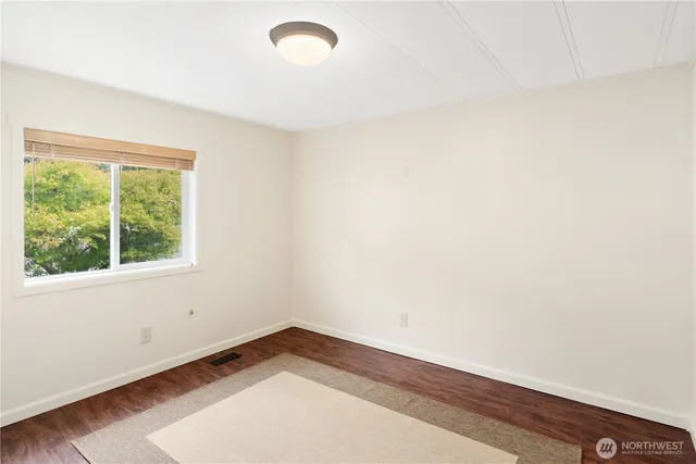 a view of a house with a yard and garden