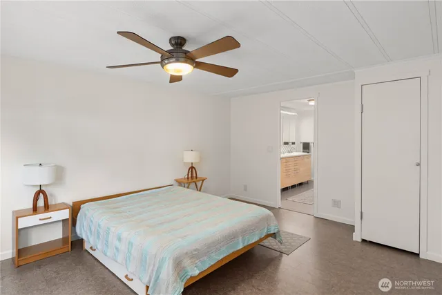 a view of a livingroom with an empty space and a window